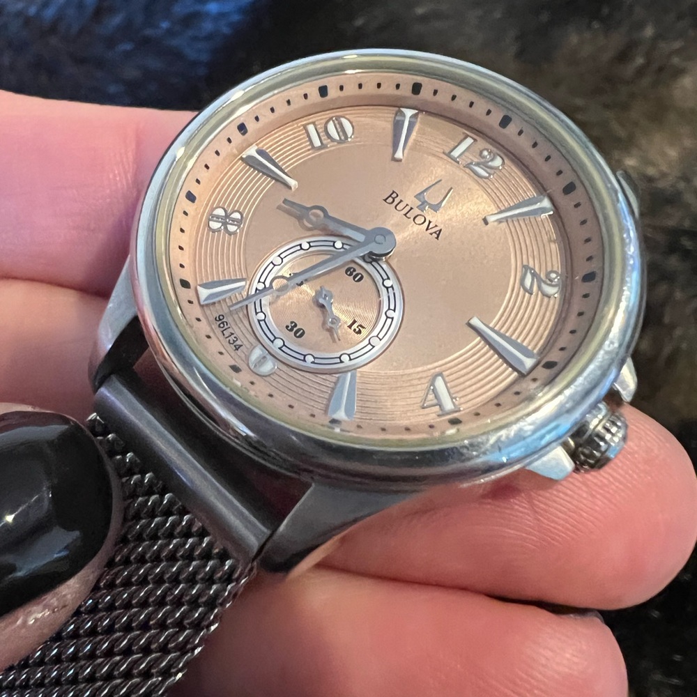 Beautiful Bulova Women’s Watch with a rose colored watch face.
